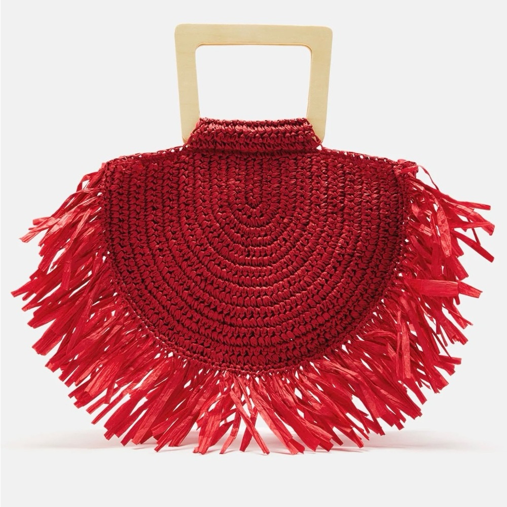 Brand new tassel bag, comes in original packaging.